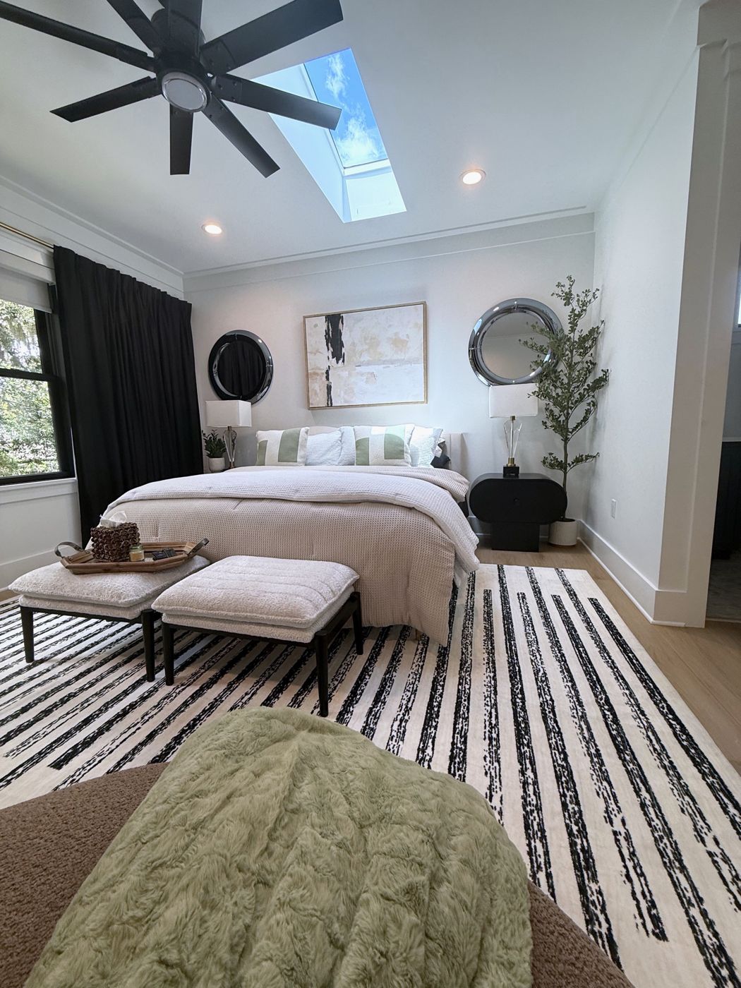Bedroom with skylight and ceiling fan